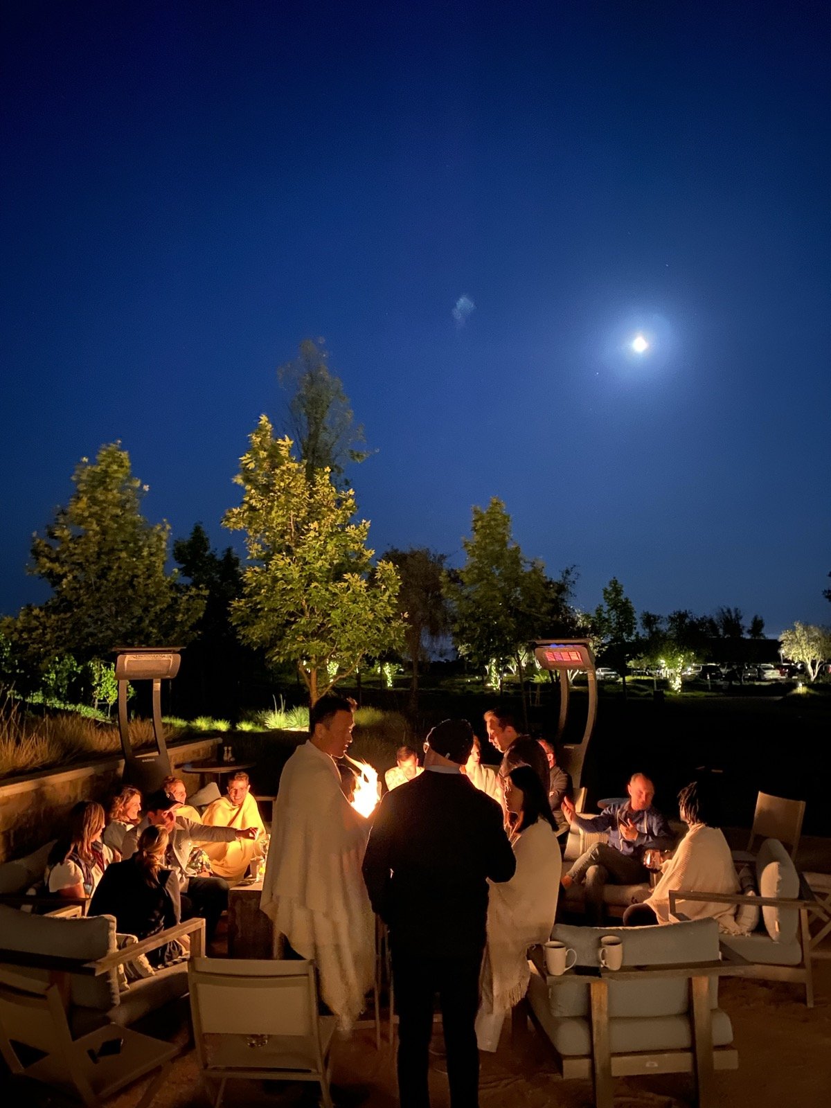 Founders around the firepit under a full moon