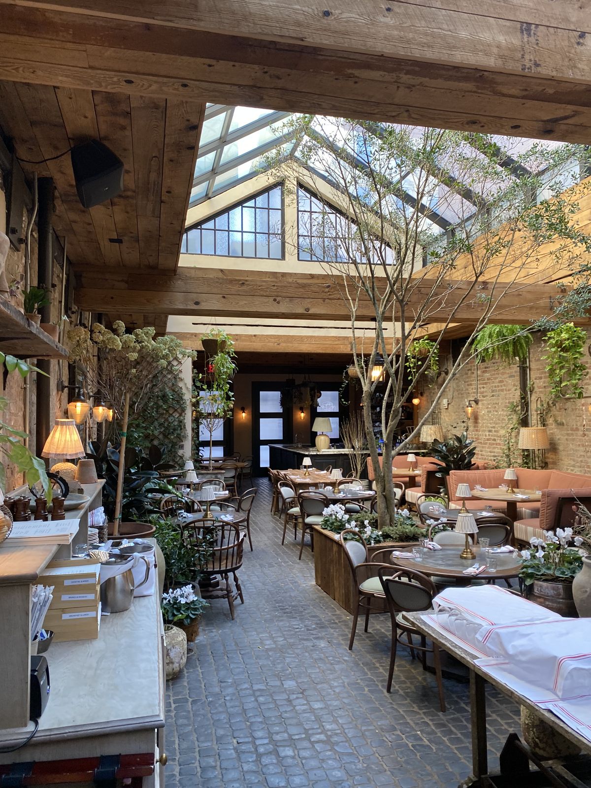 The glass-roofed atrium dining room in New York City